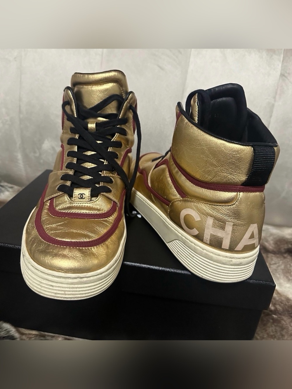 CHANEL Metallic Gold High-Top Sneakers with Burgundy Trim